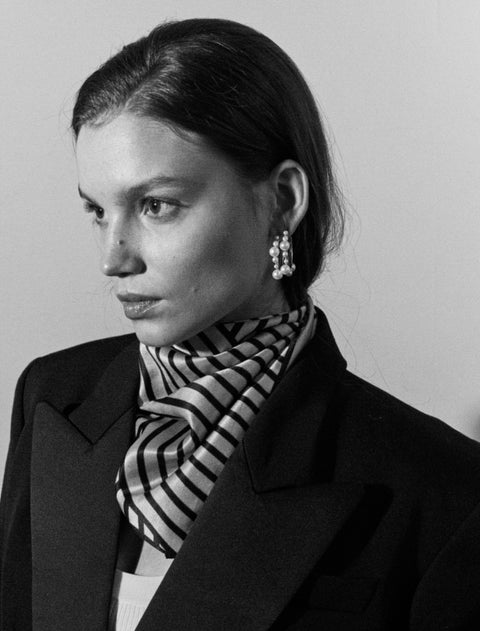 Discover the elegant and expressive hoop earrings adorned with natural pearls of varying sizes by UMIAR Jewellery. Their unique design makes them not only a beautiful accessory but also a bold statement piece in your look. Wear them on their own or paired with GEMINA inserts. Handcrafted from noble materials — 925 sterling silver and 24k gold-plated sterling silver. Find your unique style today!