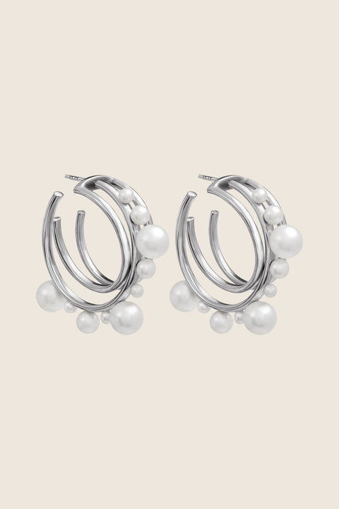 An elegant jewellery set by UMIAR Jewellery, featuring ARNO hoop earrings and the GEMINA attachment. Handcrafted in 925 sterling silver and 24k gold-plated silver, this duo offers versatile styling options, adding refined charm to any look. A unique and stylish accessory perfect for every occasion, designed to elevate your elegance. Add to cart now!