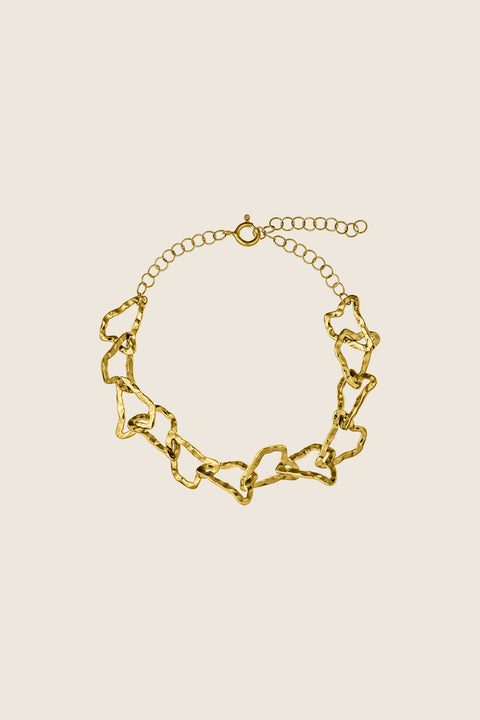 A multidimensional bracelet from the CAPRI collection by UMIAR jewellery, inspired by the contours of Monte Solaro — the highest peak of Capri. Handcrafted links adorn 925 sterling silver and 24-carat gold-plated silver. The adjustable length ensures a comfortable fit. Inspired by the island’s topography, this design reflects the graphic rhythm of its mountains and hills — a perfect harmony of nature and elegance.