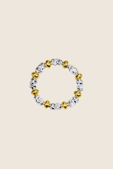 An elastic ring on jeweller’s cord by UMIAR Jewellery, crafted from alternating beads: smooth discs and elongated spheres with an irregular texture. It combines exceptional comfort with refined elegance. Entirely made from 925 sterling silver and 24k gold-plated 925 silver. Add a distinctive design piece to your collection — order now!
