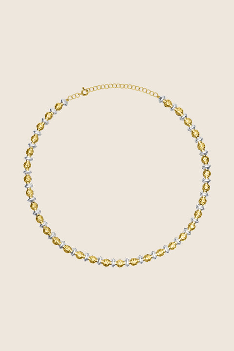 Discover the PARS necklace from UMIAR Jewellery — the perfect choice for those who love both gold and silver. Made from alternating 925 silver beads plated with 24k gold, it blends elegance with a distinctive, contemporary design. Part of the MÉLANGÉ collection, it harmoniously combines materials and styles to create a refined accessory for any look. Shop now!