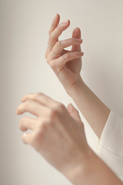 This thin, minimalist band with a subtle rounded profile is a timeless piece that pairs beautifully with other rings, including the PLURES set. Perfect as an everyday accent or a discreet wedding band for those who appreciate classic simplicity and elegance. Discover UMIAR jewelry and order online.