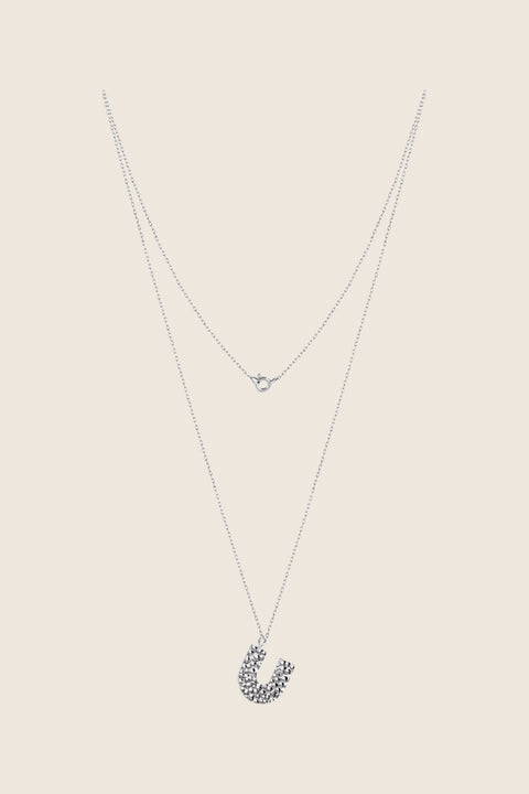 Add a touch of elegance to your collection with UMIAR jewelry. This U-shaped necklace with a hammered finish is handcrafted from 925 sterling silver or 925 sterling silver plated with 24-karat gold. Part of the WIĘZI Collection, it draws on traditional craftsmanship and open-work detailing. A unisex design created to celebrate meaningful connections.
