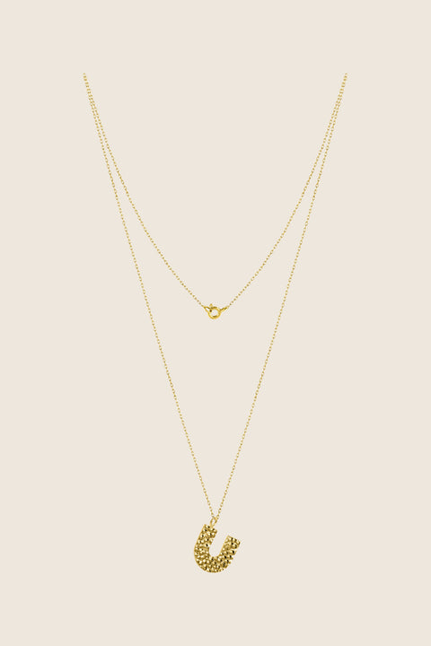 Add a touch of elegance to your collection with UMIAR jewelry. This U-shaped necklace with a hammered finish is handcrafted from 925 sterling silver or 925 sterling silver plated with 24-karat gold. Part of the WIĘZI Collection, it draws on traditional craftsmanship and open-work detailing. A unisex design created to celebrate meaningful connections.