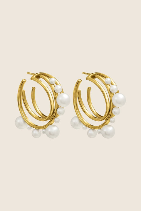An elegant jewellery set by UMIAR Jewellery, featuring ARNO hoop earrings and the GEMINA attachment. Handcrafted in 925 sterling silver and 24k gold-plated silver, this duo offers versatile styling options, adding refined charm to any look. A unique and stylish accessory perfect for every occasion, designed to elevate your elegance. Add to cart now!